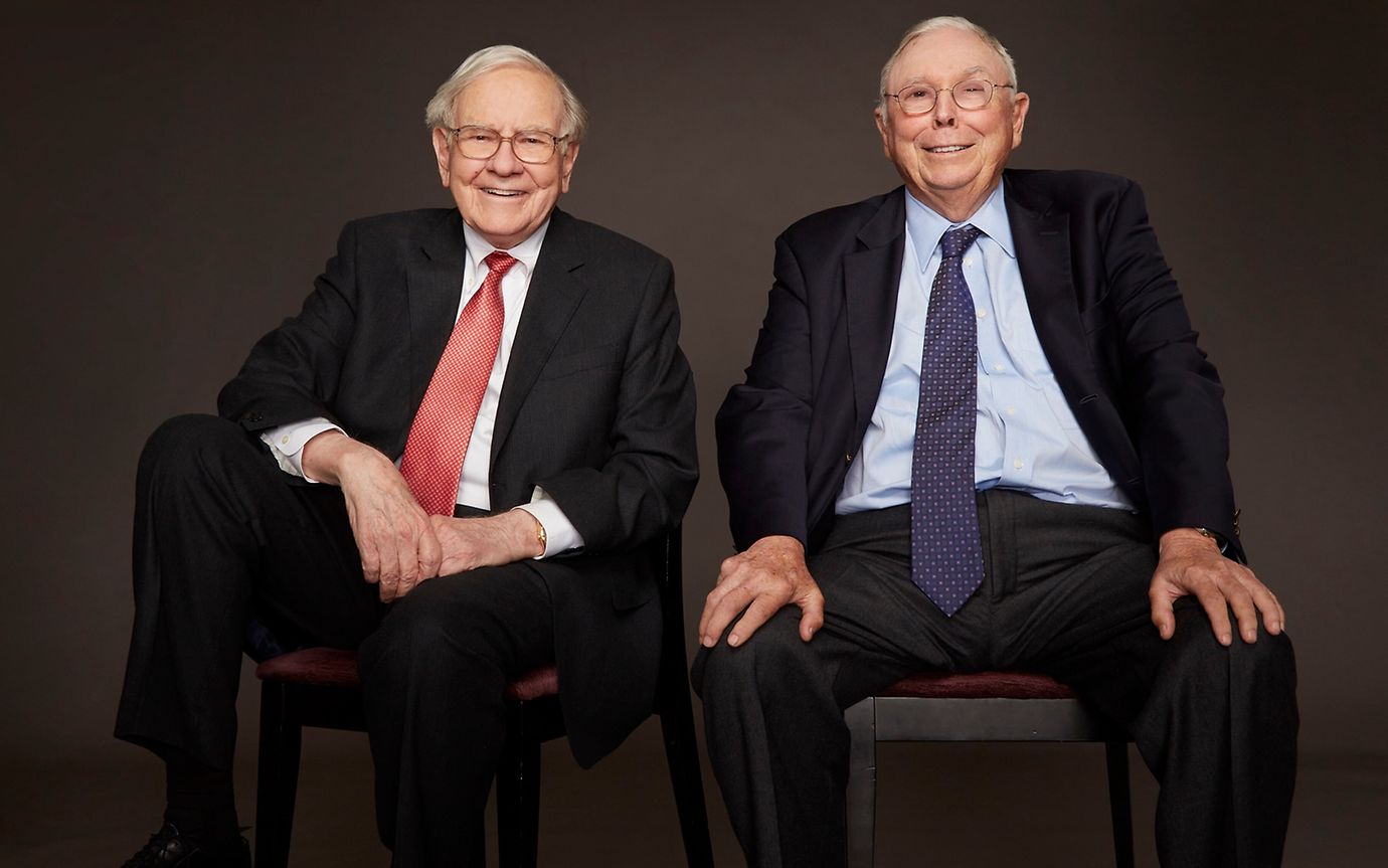 Two elderly gentlemen in suits and ties at a photo shoot