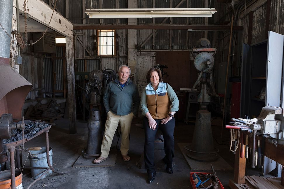 Yvon Chouinard, company founder, and Rose Marcario, Managing Director at Patagonia, stand in a tool room.