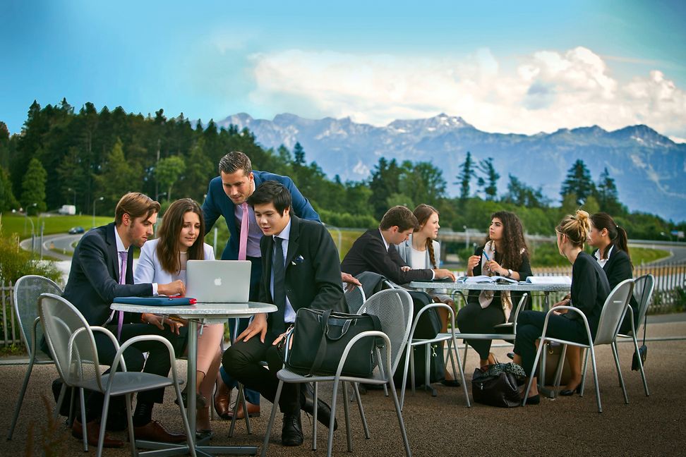EHL students studying outside in front of the Alps