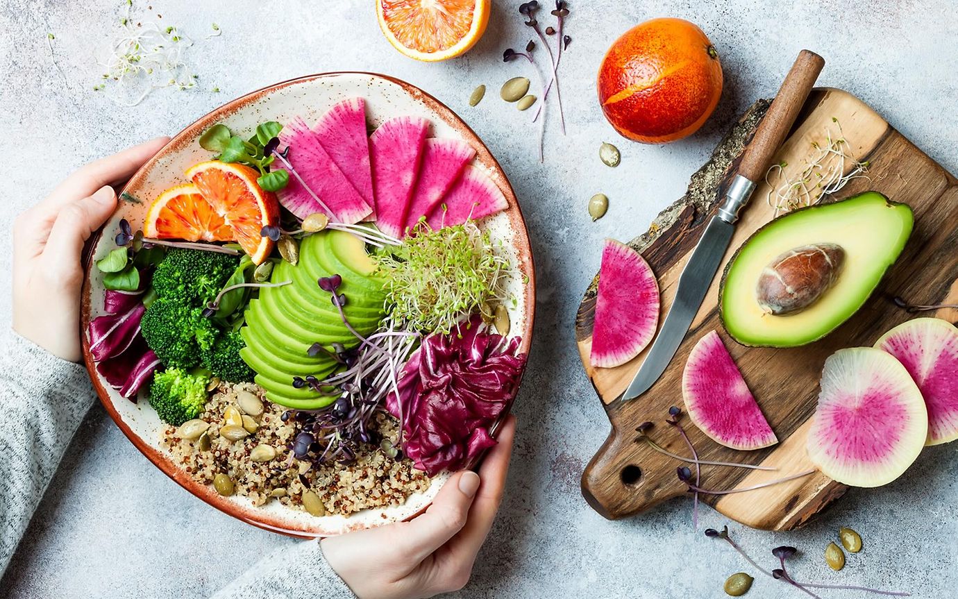 Colourful superfoods on a plate such as avocado, quinoa and olives