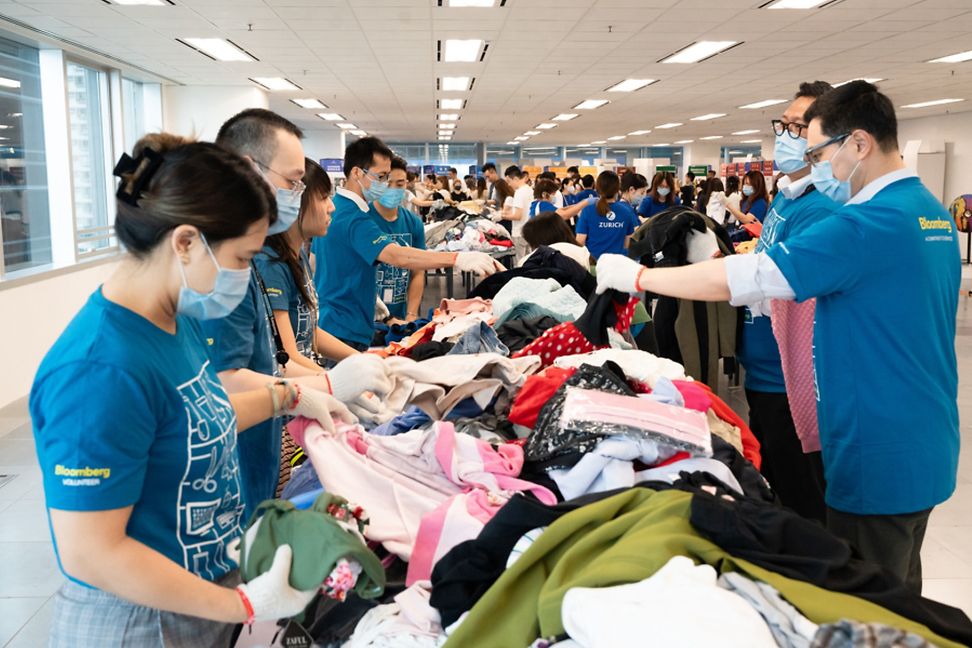 Volunteers or workers in Hong Kong sorting out clothes.