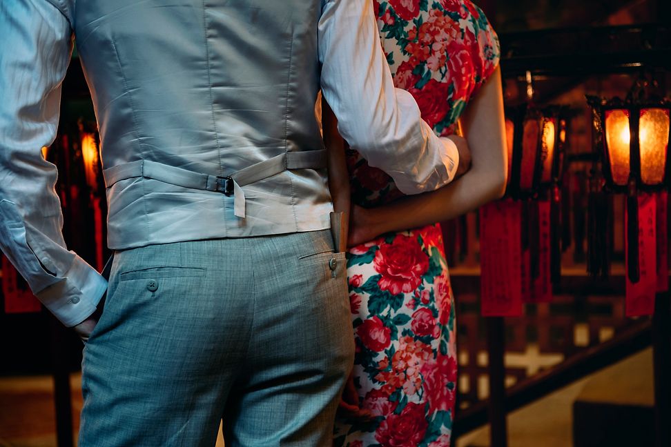 Elegantly dressed woman and man from behind in Hong Kong