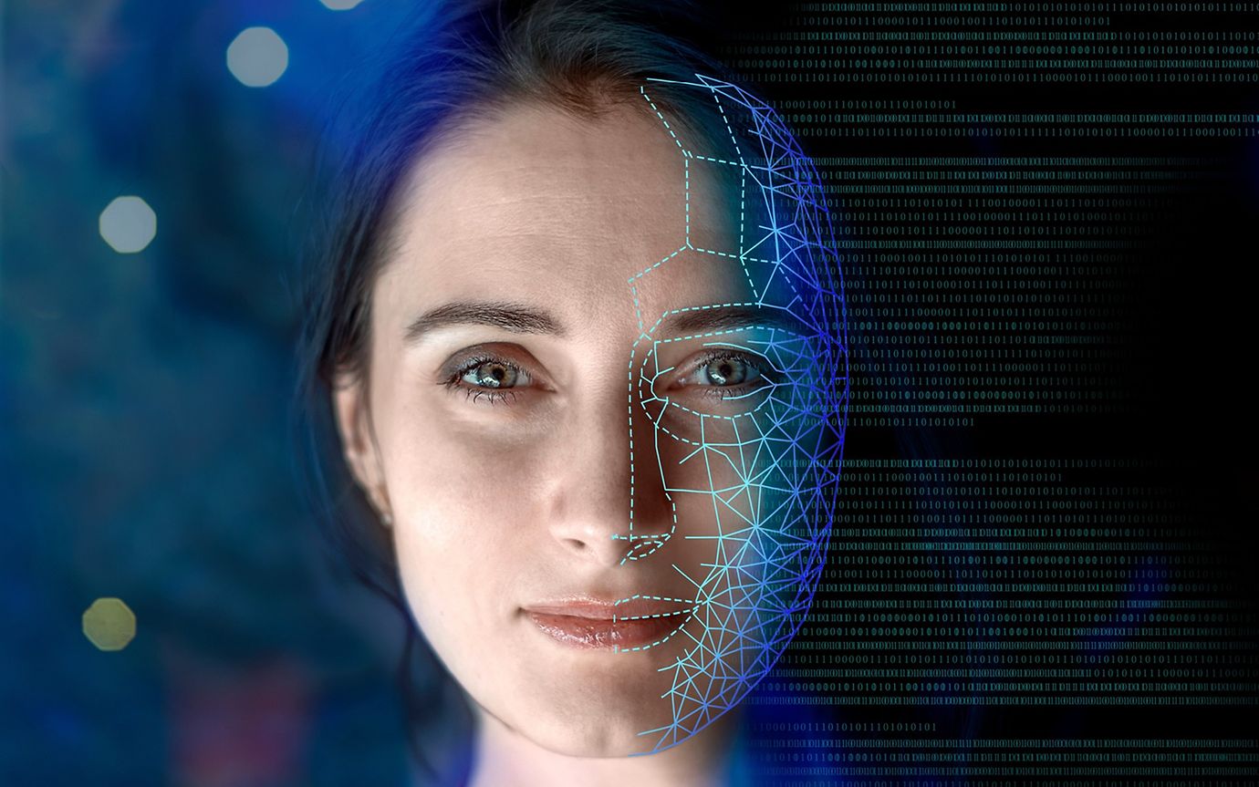 Visualisation of a person with an electronic network superimposed over half of her head