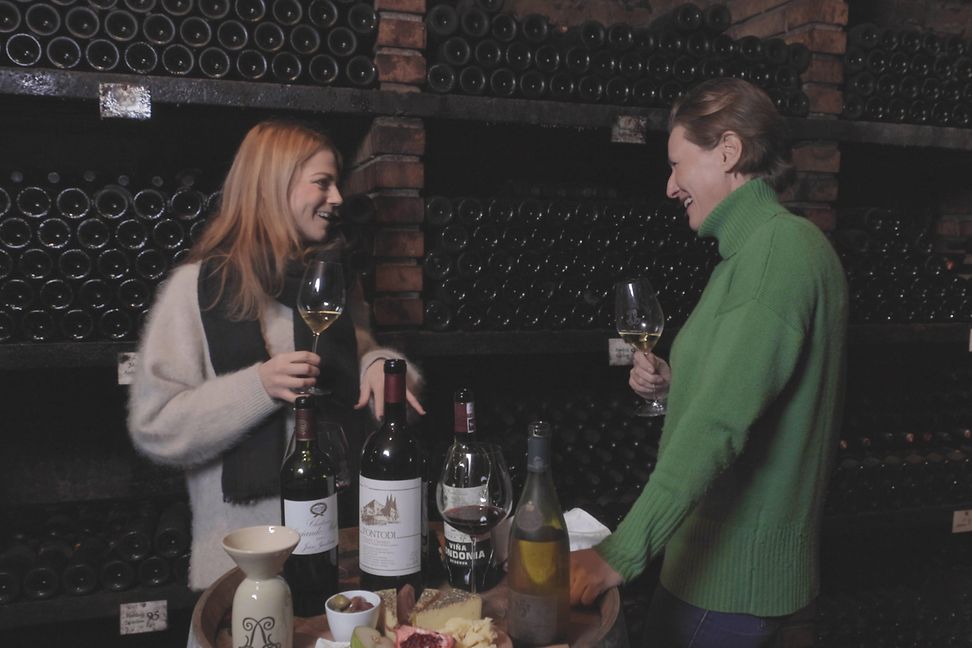 Lisa Bader and Princess Marie stand together in the cellar, look at each other and talk. 