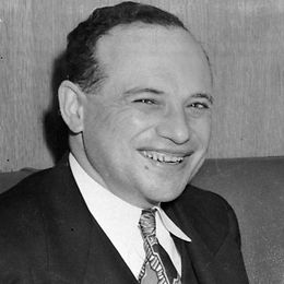 Black-and-white photo of a man in a suit and tie; the historic nature of the image is evident from its quality.